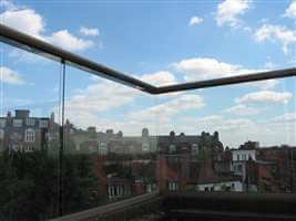 Clear view through clear glass balcony with no corner posts and with Royal Chrome handrails