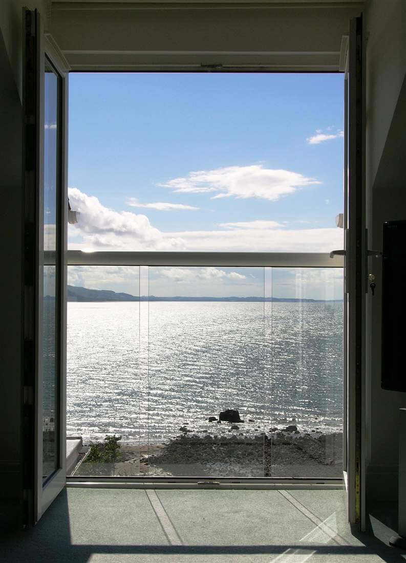 Beautiful sea view from white Juliet balcony