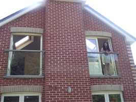 Symmetric bronze Juliet balconies