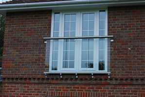 Juliet balcony on brick house with Royal Chrome handrail