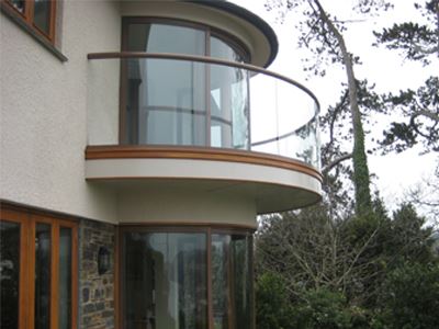 side view of cured glass door on a balcony on the second floor