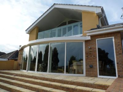 White curved glass sliding doors