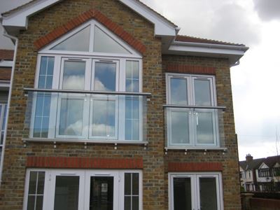 Two Royal Chrome Orbit Juliet Balconies installed on a pretty house