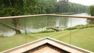 Aerofoil Hybrid Glass Balustrade with a riverside view