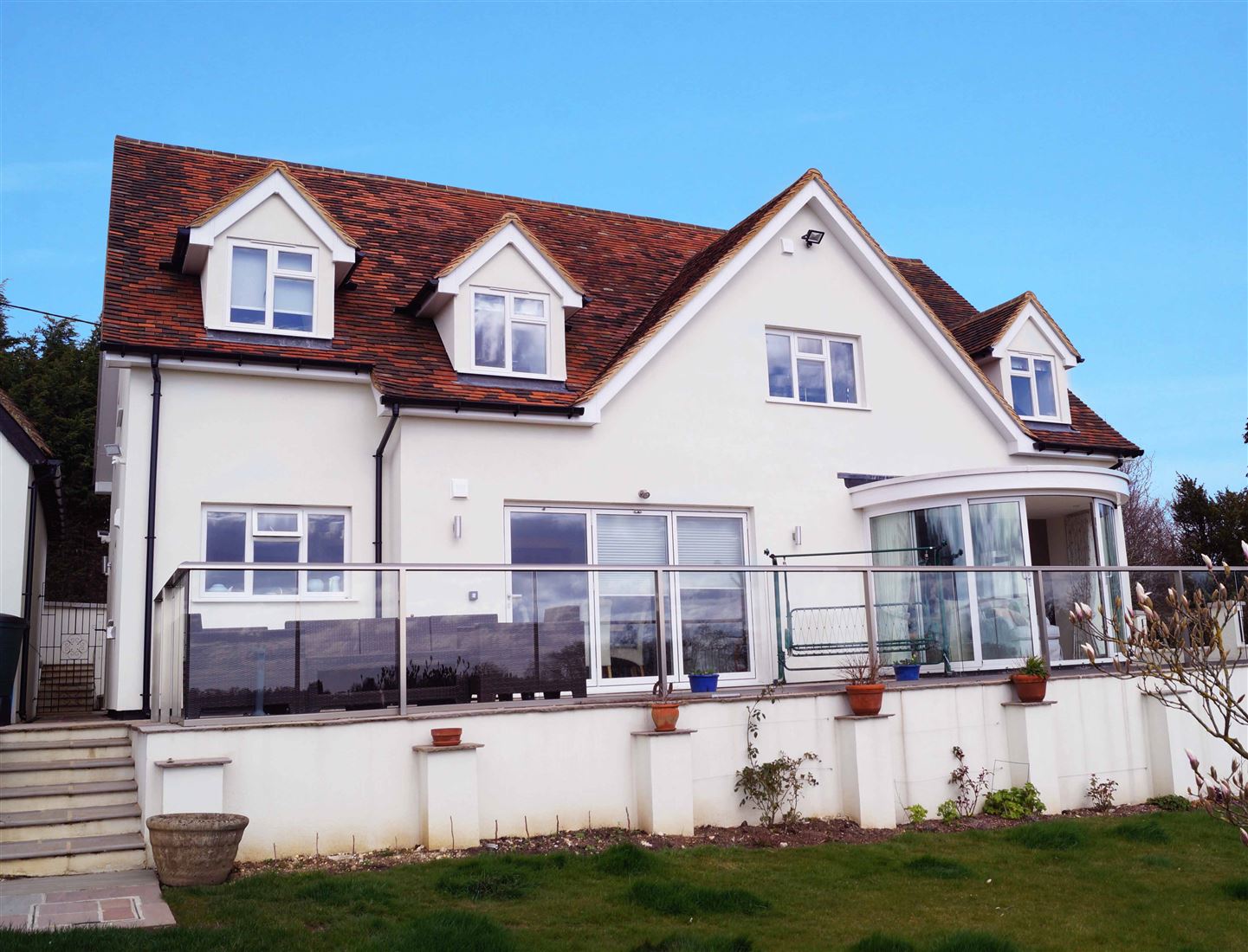 Curved Doors and Glass Balustrade