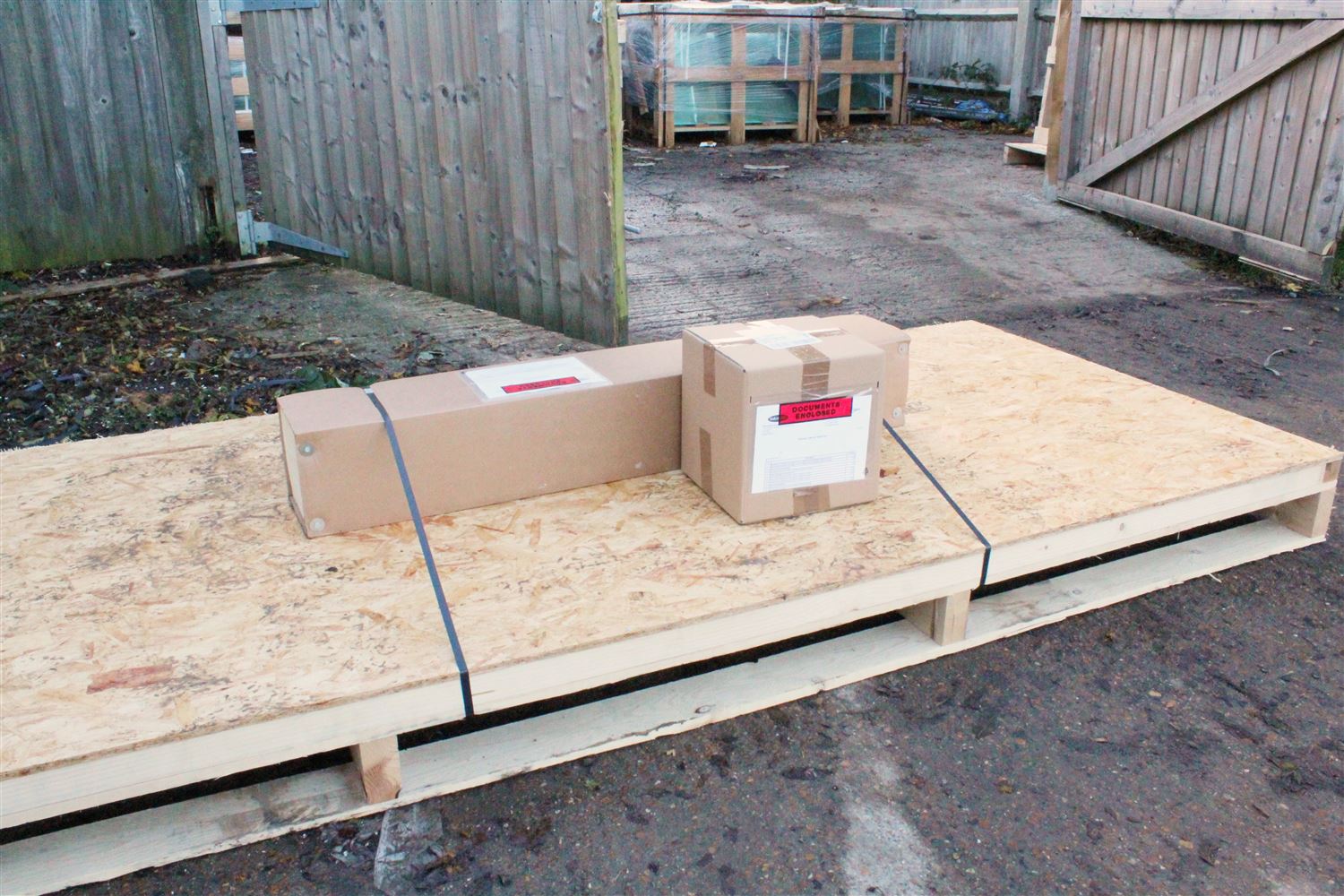 Boxed laminated glass laid flat on a pallet ready for delivery 