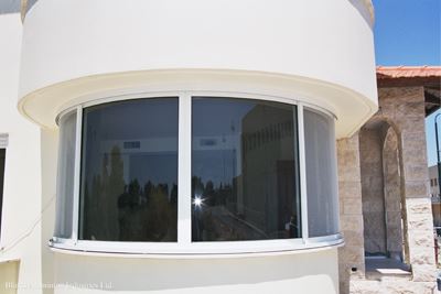 Curved Glass installed in a white building 