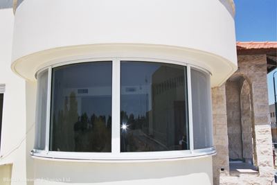 Curved Glass installed in a white building