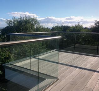 Bronze Aerofoil Glass Balustrade with Golden Oak Composite Decking