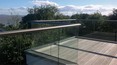 Glass Balustrade overlooking some beautiful shrubs and topiaries