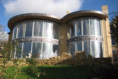 Multiple sets of Curved Glass Doors installed in a modern property