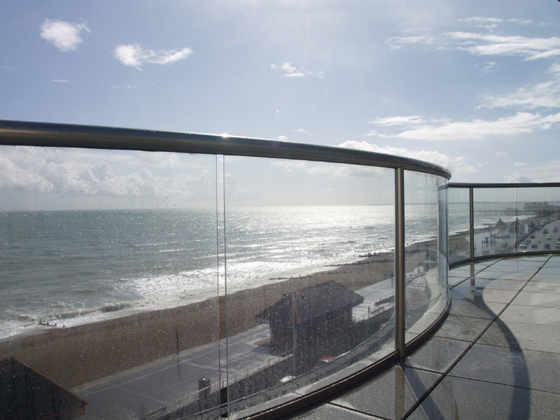 Sunset through a glass curved balcony