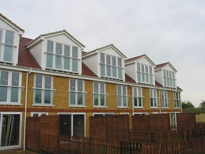 Matching White Juliet balconies at the back of the residences