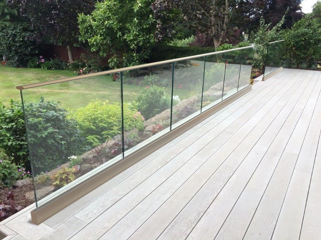 Frameless glass balustrade with top rail above floor level