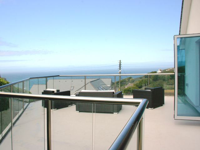 22 metres of irregular-shaped glass balustrading installed at this property overlooking the sea at Mawgan Porth in North Cornwall