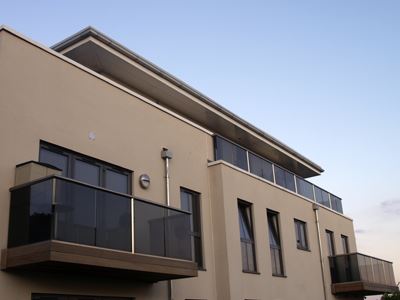 Multiple tinted Glass Balustrades installed on a modern building