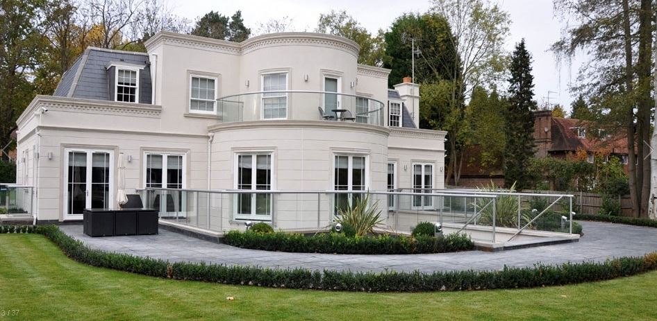 Silver Orbit Glass Balustrade installed on a grand white house