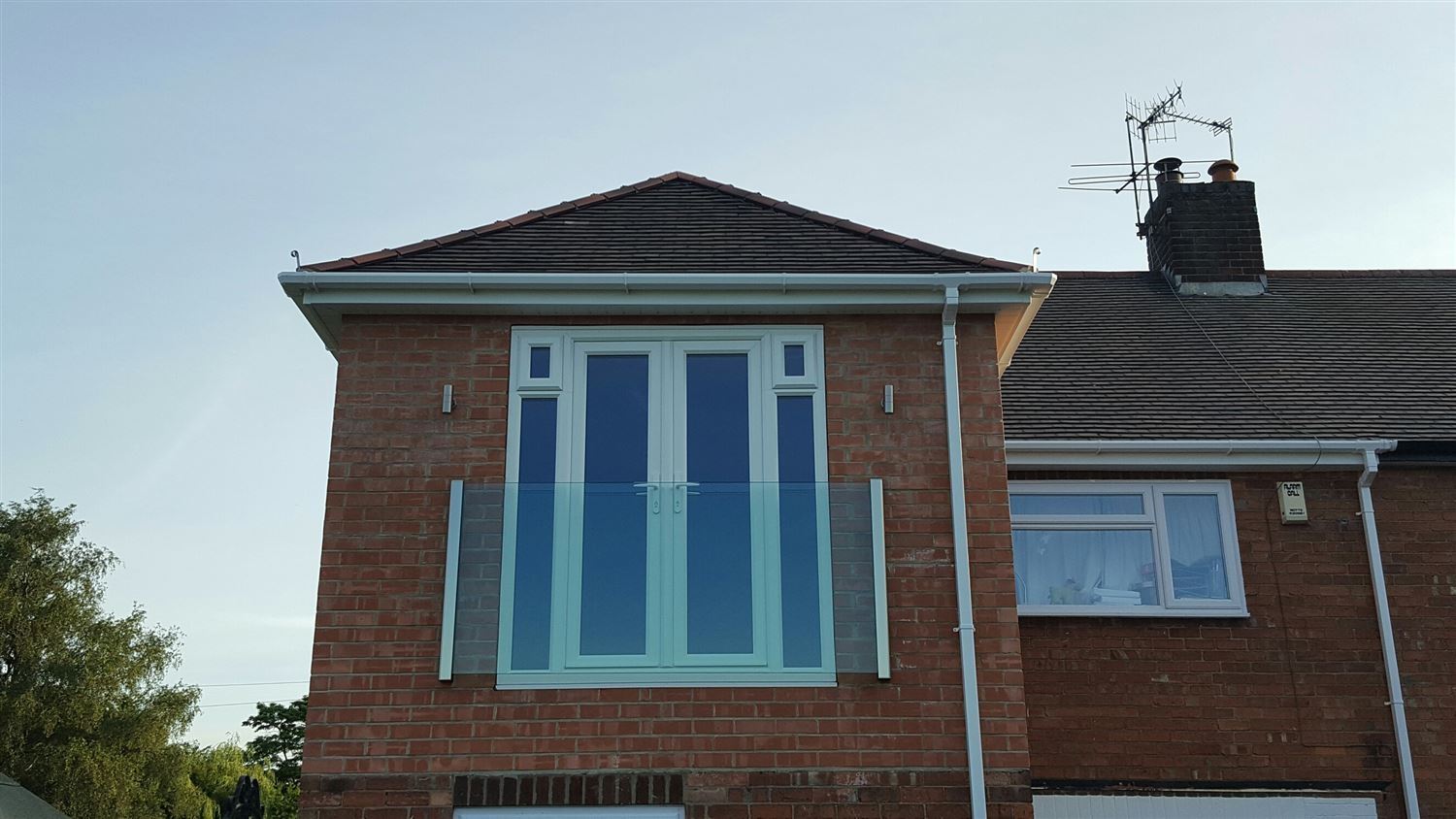 Frameless Juliet Balcony installed on a brick property