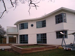 Curved Glass Windows on white house