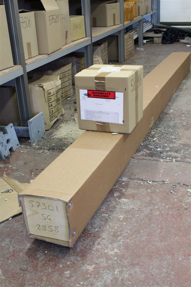 Packaged Balcony metalwork (profiles, bottom rail, post covers etc) and assembly accessory box ready for delivery