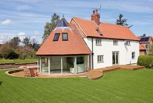 Curved Glass Sliding Doors on pretty house in the sun