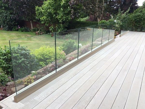 Frameless Glass Balustrade (fitted above floor level) with a beautiful garden view