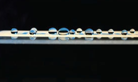 Droplets of water on glass surface showing the resistance to the glass coating