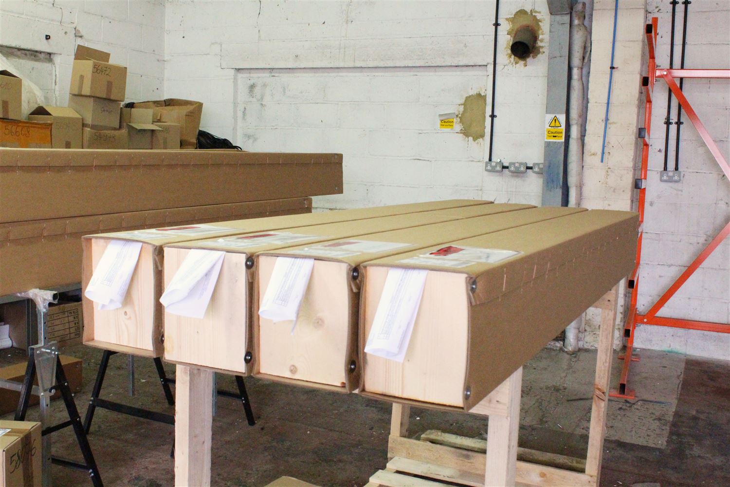 Packaged Balcony metalwork (profile sections, bottom rail, post covers etc) in carton boxes ready for delivery 