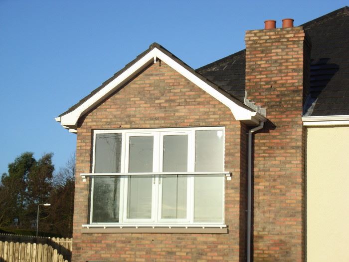 White Juliet Balcony, installed on a brick house in Ireland