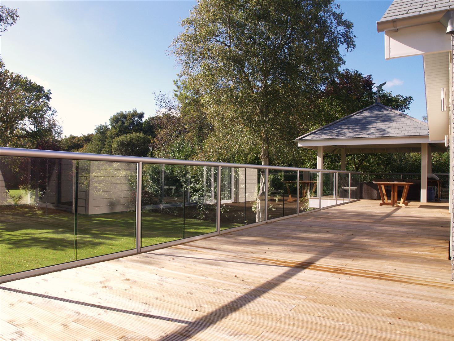 Long stretch of beautiful silver Orbit Glass Balustrading with a lovely countryside view