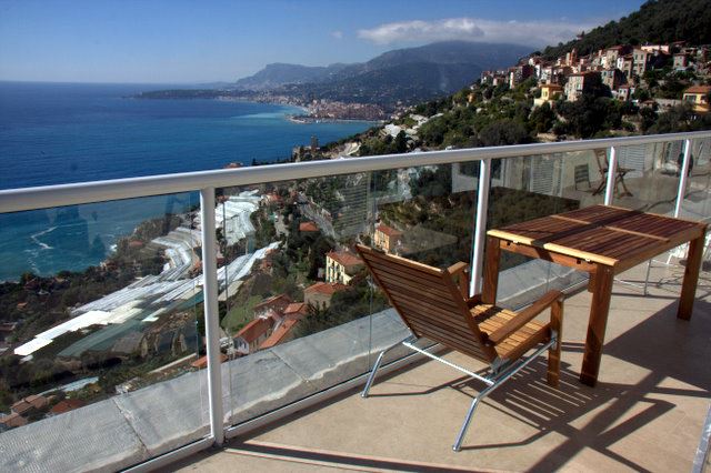 White Orbit Glass Balustrade looking down on the beautiful mountains and coast