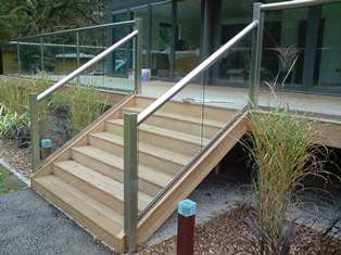 Glass Banister on stairs with Royal Chrome posts and handrails