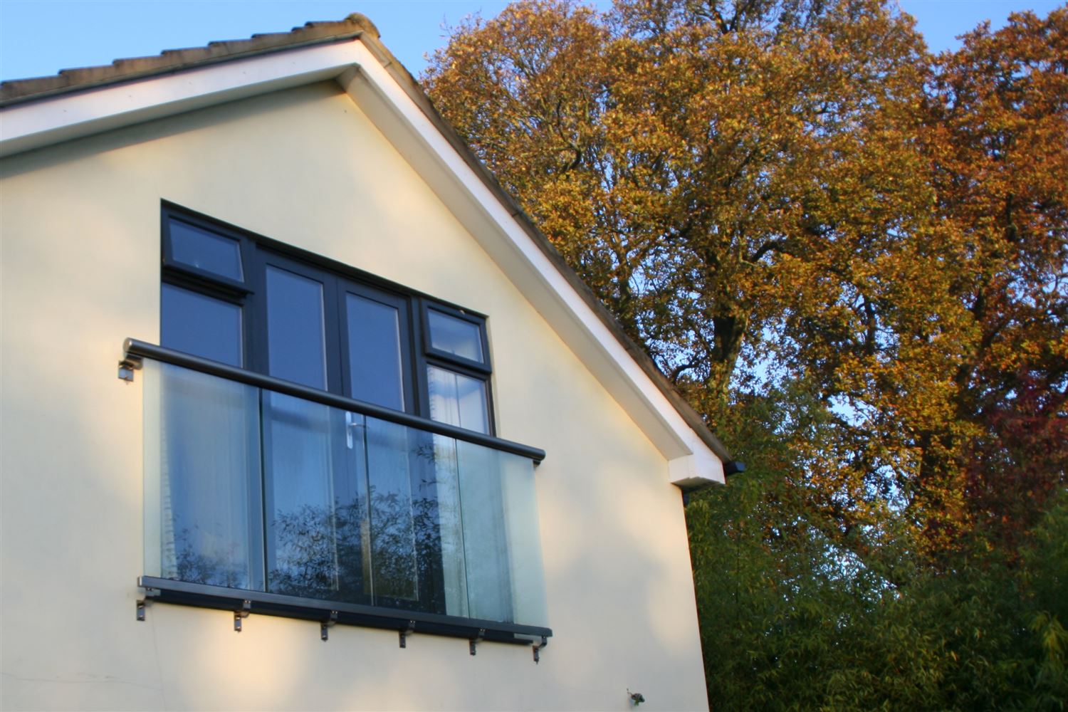 Side view of a Royal Chrome Orbit Juliet balcony in the sun